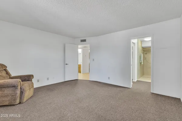 a bathroom with a shower and toilet