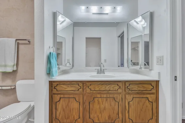 a bathroom with a shower and toilet