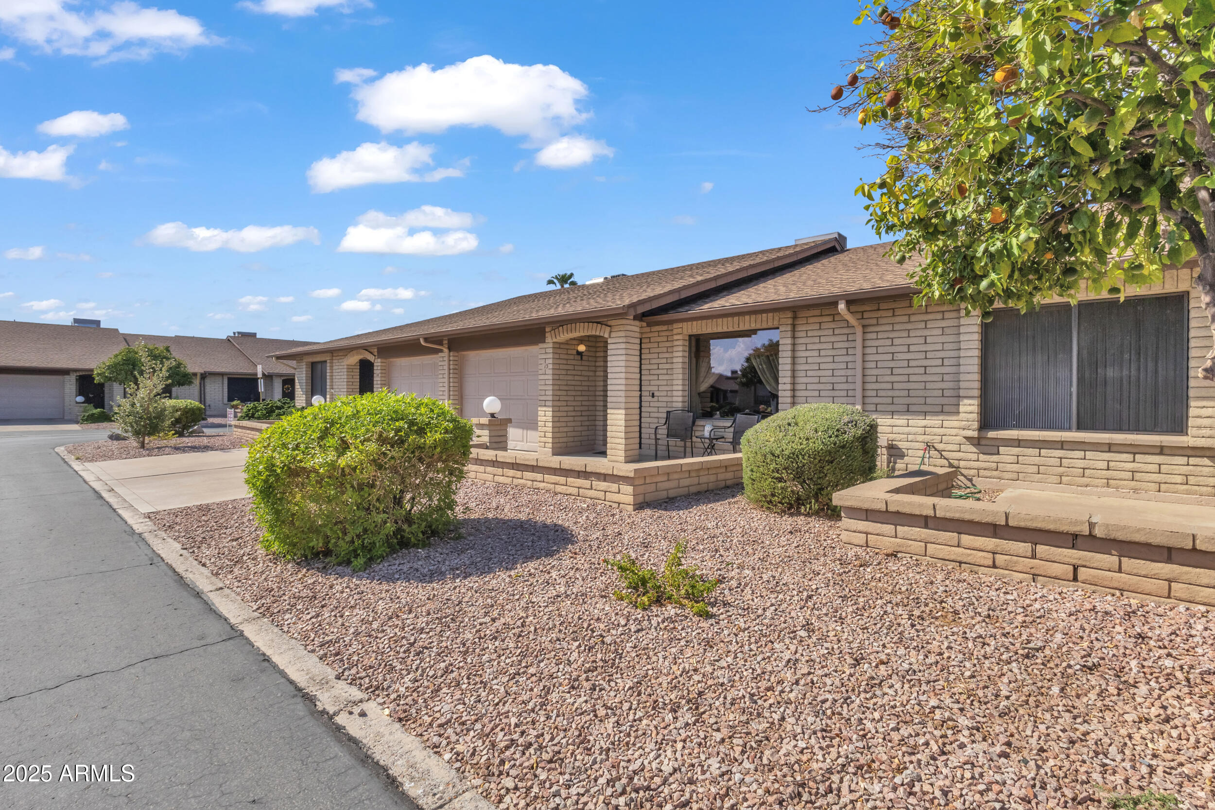 520 South Greenfield Road, Unit 13 Mesa, AZ 85206 - Photo 5 of 44 a view of a house with a yard and large tree