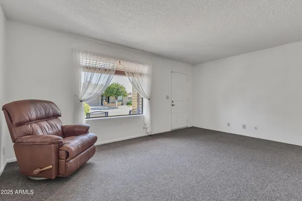a living room with furniture and a window