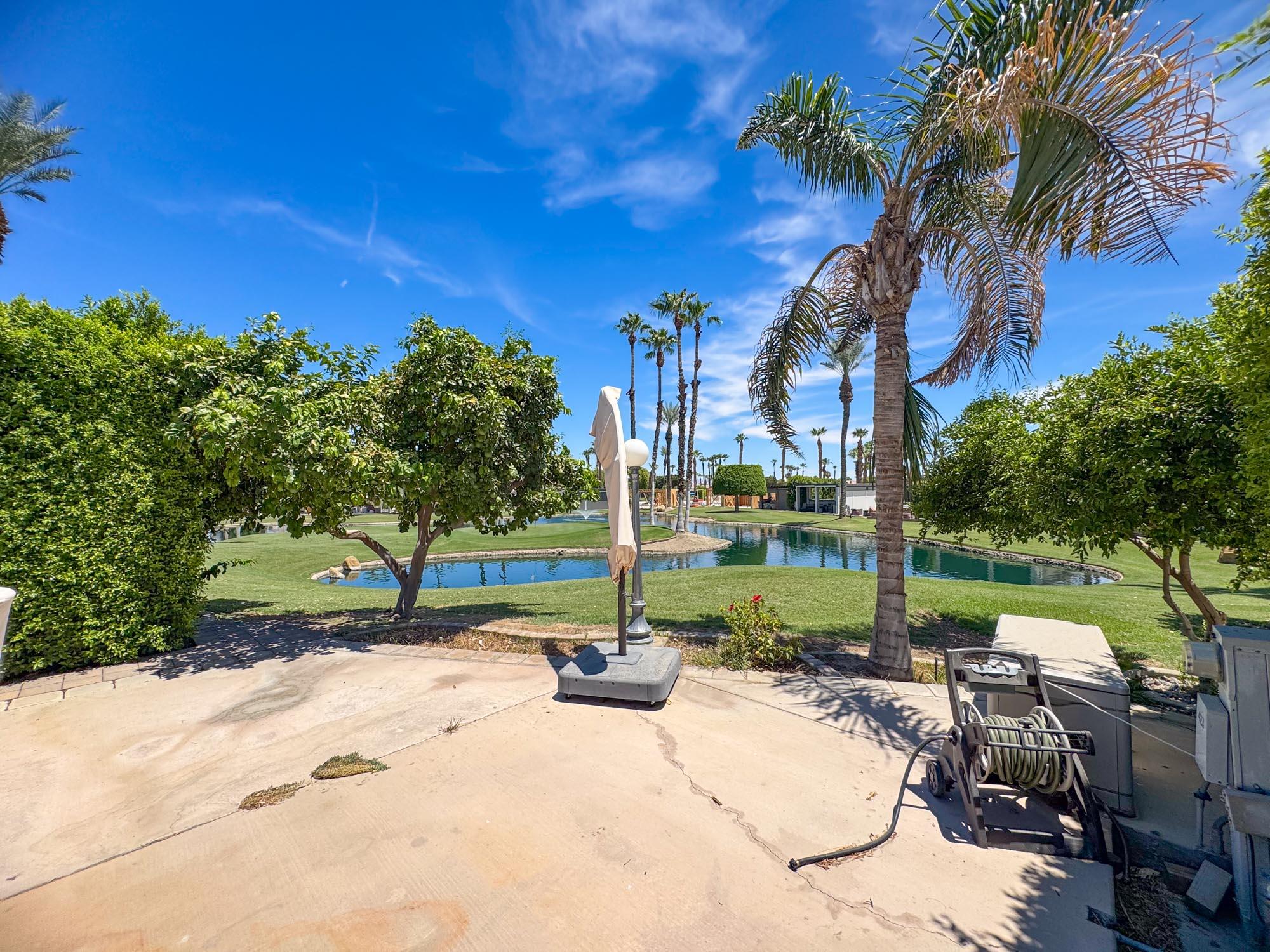 80394 Ave 48, Unit 423 Indio, CA 92201 - Photo 10 of 18 a view of a park with swings and slides