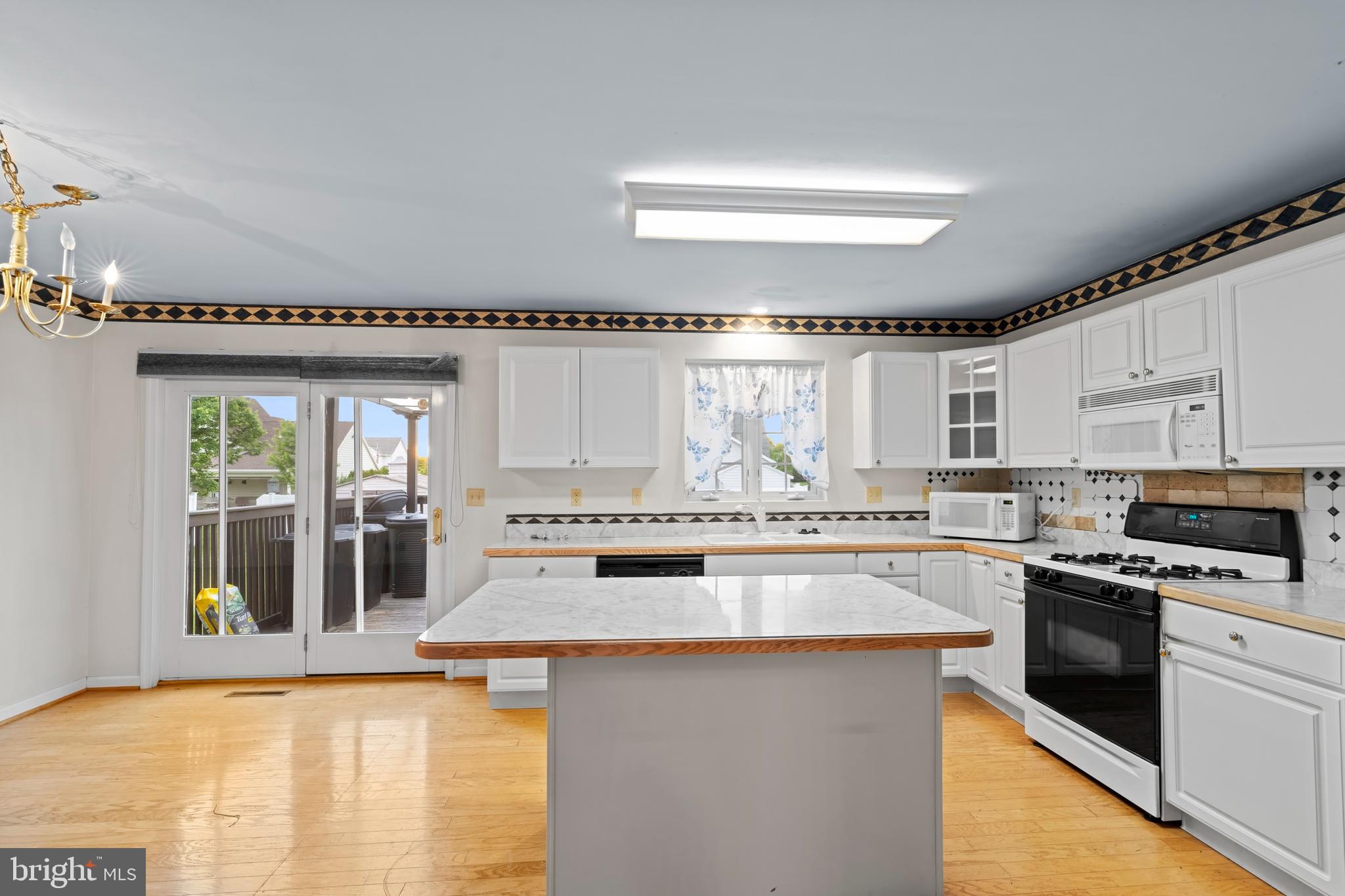 1004 Hostetter Road Hanover, PA 17331 - Photo 4 of 15 a kitchen with stainless steel appliances granite countertop a stove a sink and a microwave