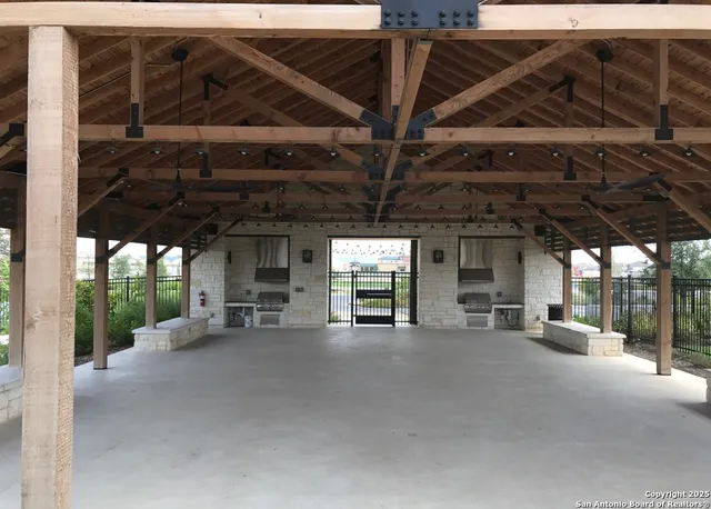 a view of swimming pool with outdoor seating and a yard