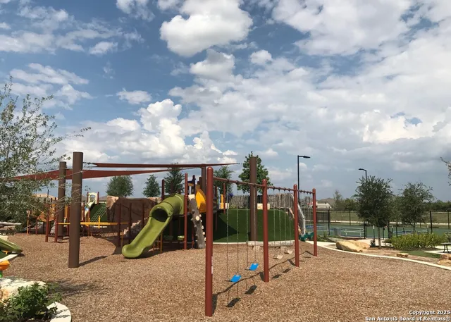 an aerial view of a house yard swimming pool and outdoor seating