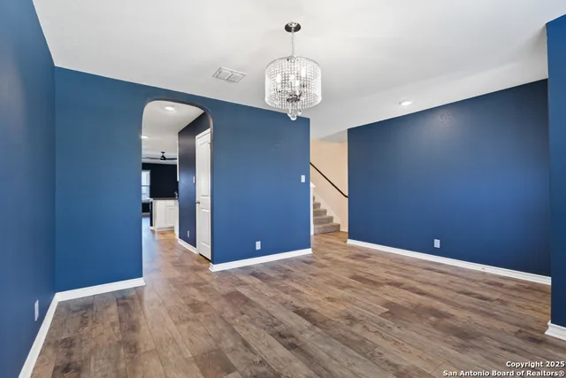 a kitchen with stainless steel appliances a microwave a stove and a refrigerator