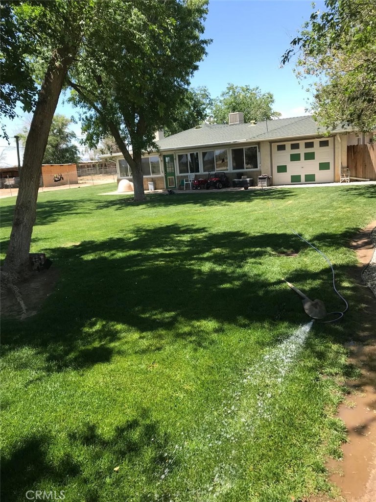 44665 95th Street East Lancaster, CA 93535 - Photo 13 of 34 a view of a house with a yard