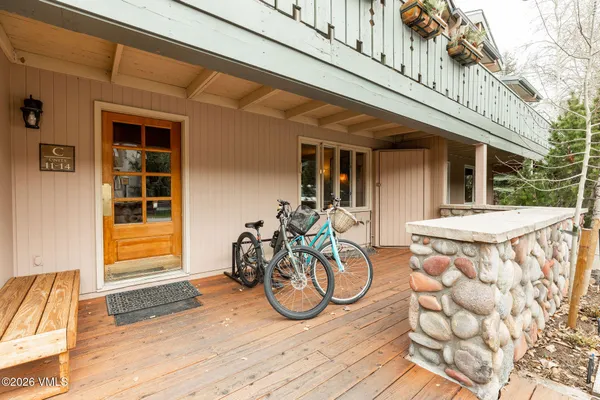 a view of a wooden chairs with a table and chairs