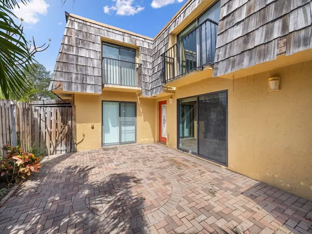a view of staircase with wooden floor and a bathroom