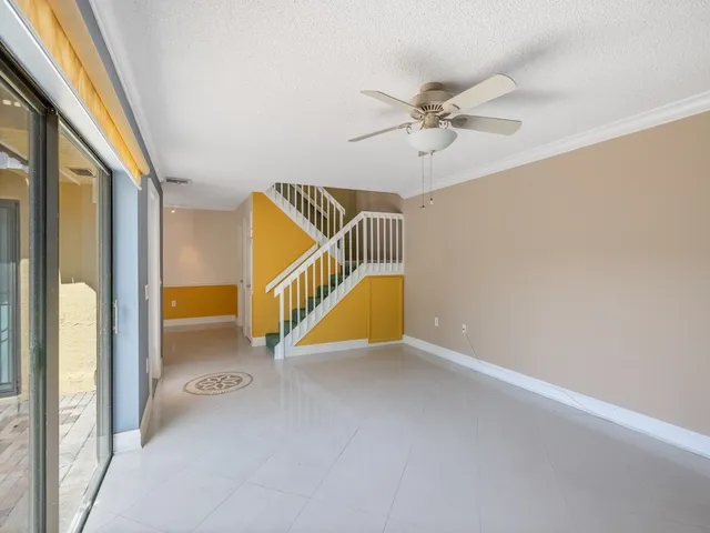 a view of a hallway view with staircase