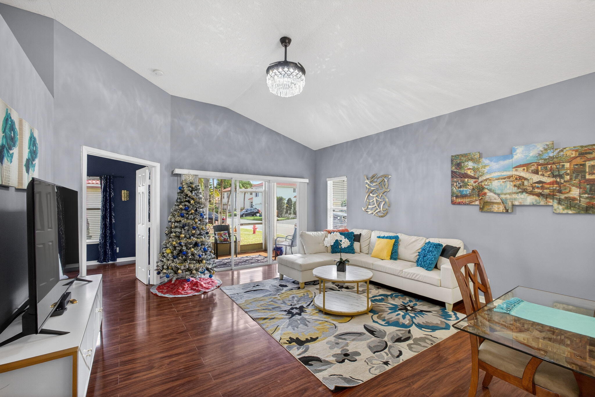 5156 Elpine Way Riviera Beach, FL 33418 - Photo 24 of 97 a living room with furniture and a floor to ceiling window