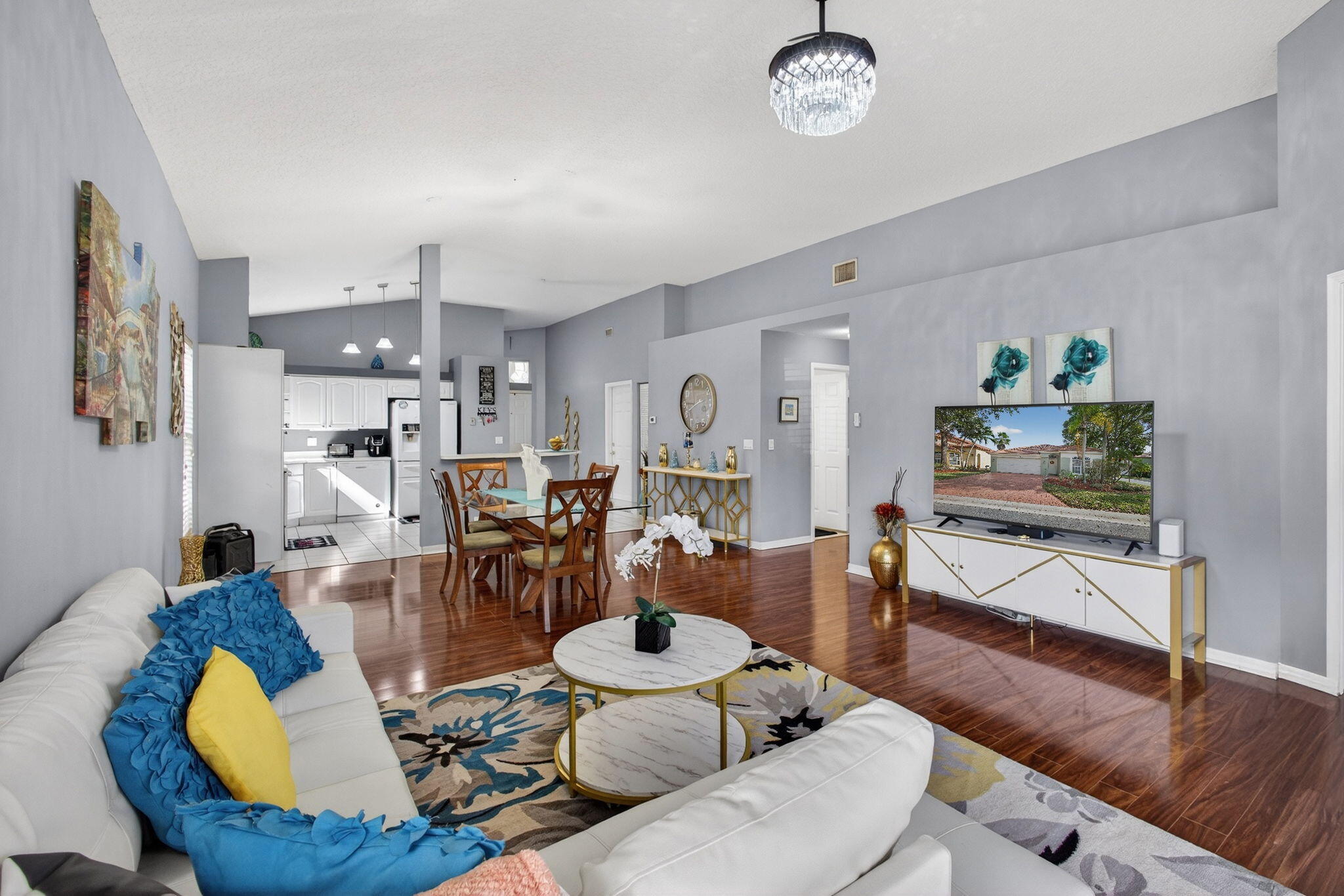 5156 Elpine Way Riviera Beach, FL 33418 - Photo 29 of 97 a living room with furniture kitchen view and a wooden floor