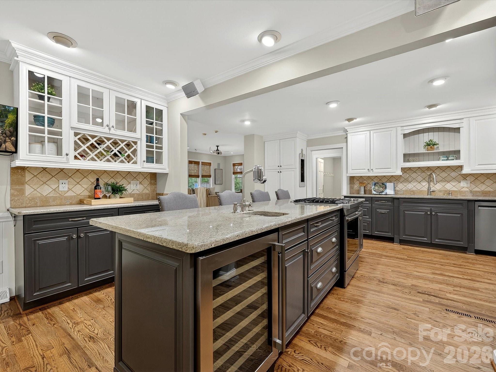 6344 Dovefield Road Charlotte, NC 28277 - Photo 11 of 46 a kitchen with granite countertop a sink and cabinets