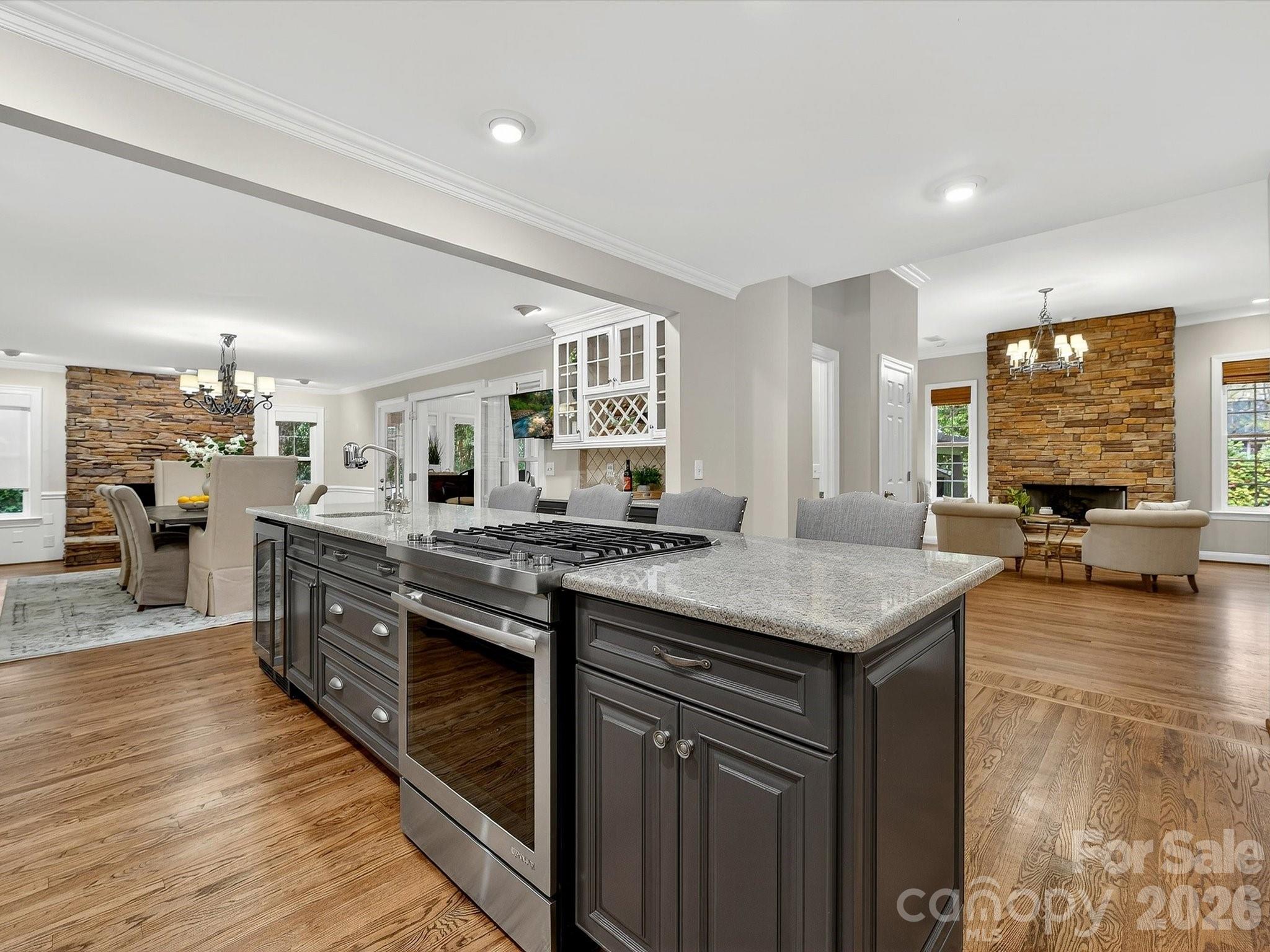6344 Dovefield Road Charlotte, NC 28277 - Photo 13 of 46 a kitchen with lots of counter top space and wooden floor