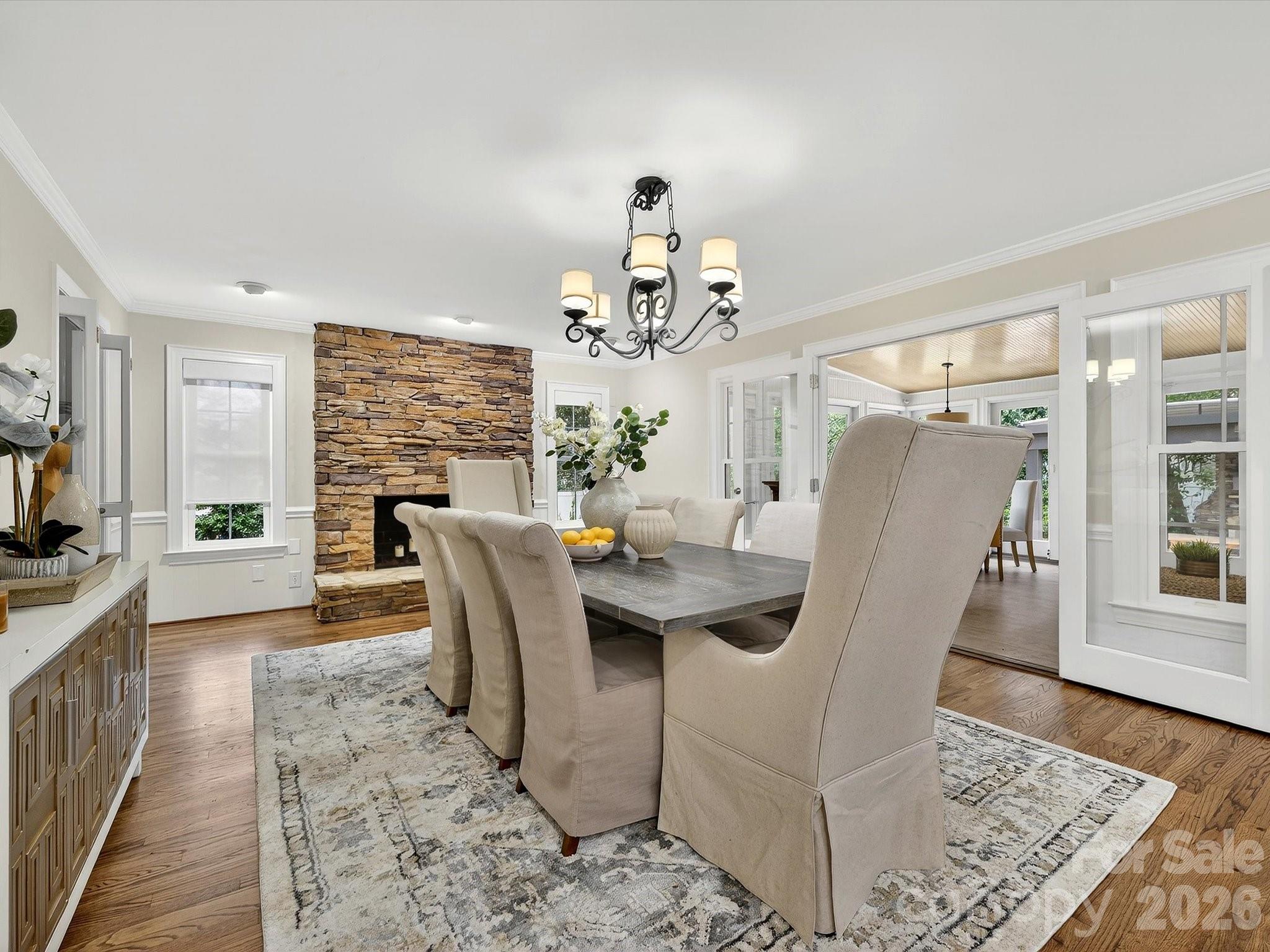 6344 Dovefield Road Charlotte, NC 28277 - Photo 14 of 46 a dining room with furniture a rug and wooden floor