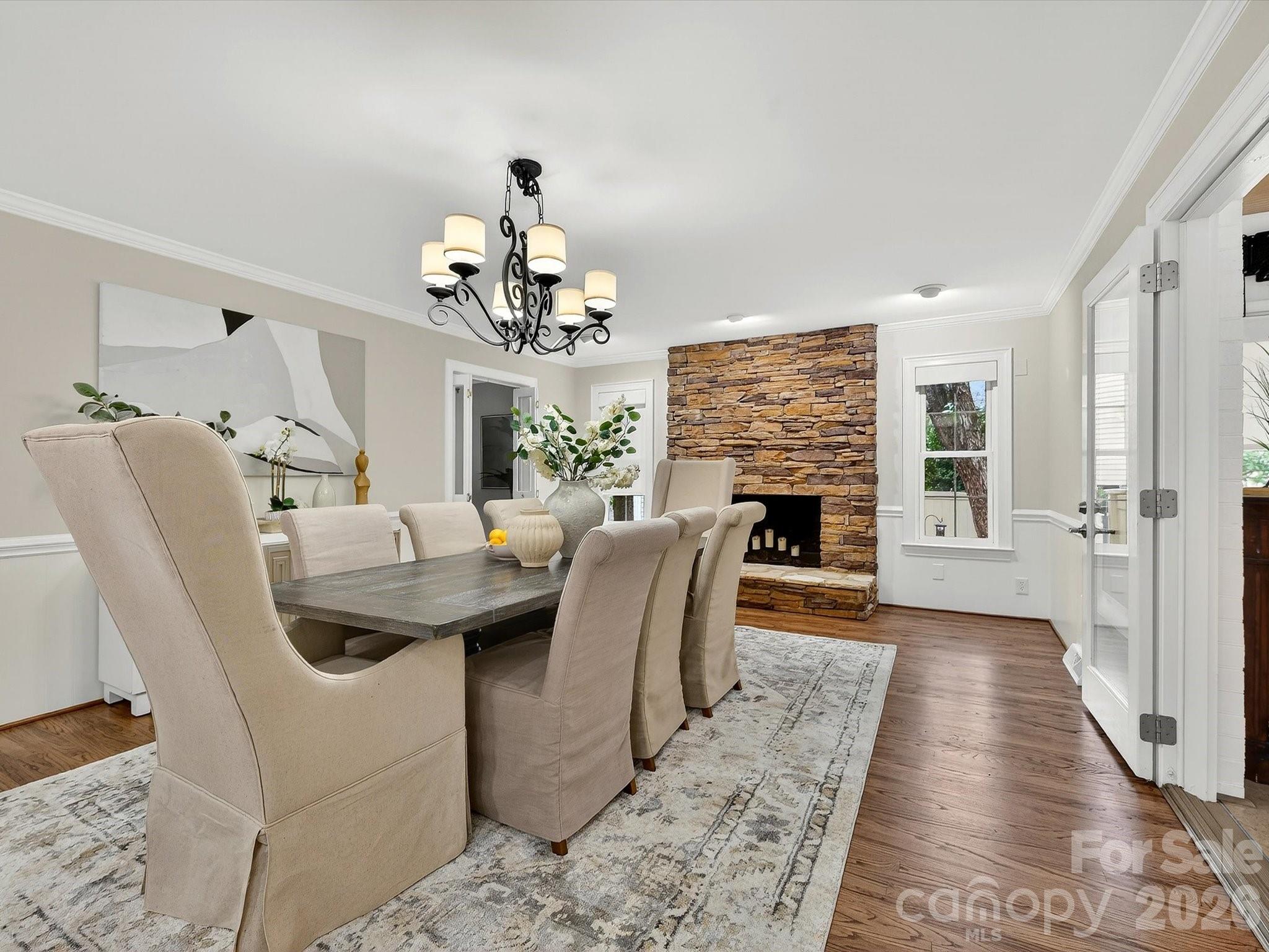 6344 Dovefield Road Charlotte, NC 28277 - Photo 15 of 46 a living room with furniture a fireplace and chandelier