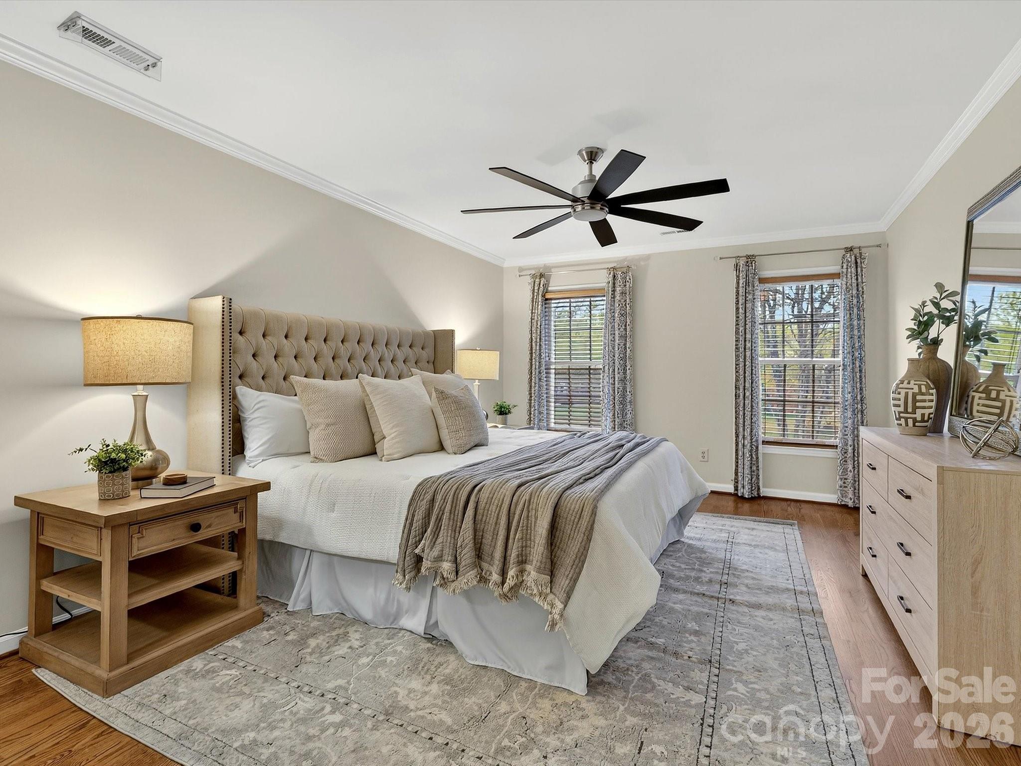 6344 Dovefield Road Charlotte, NC 28277 - Photo 24 of 46 a spacious bedroom with a bed and a lamp