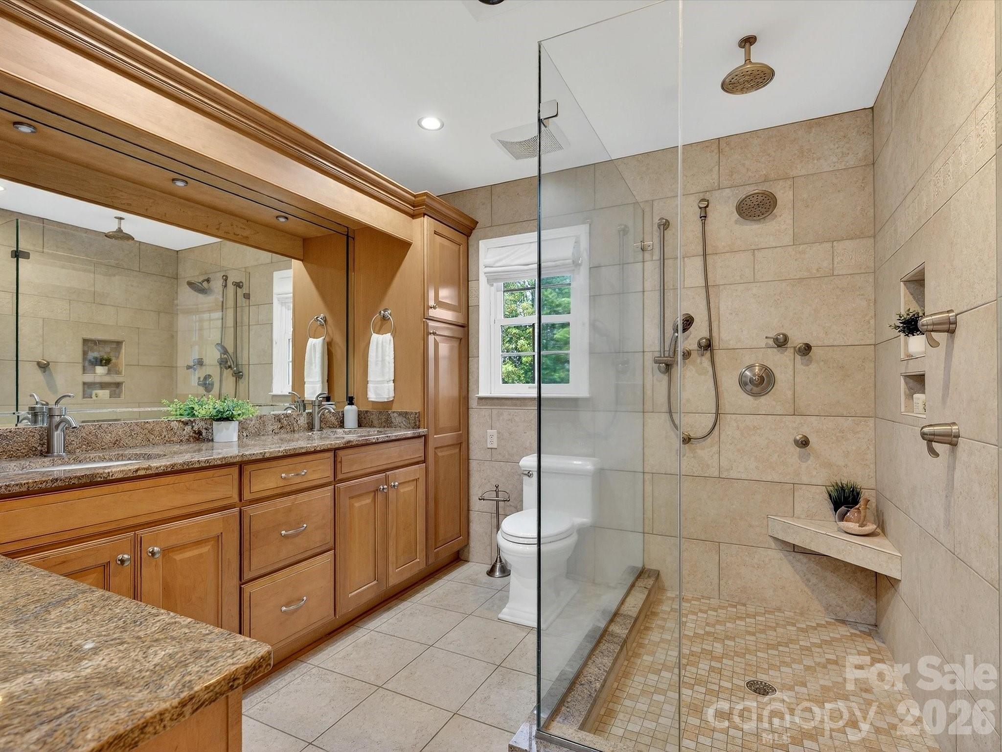 6344 Dovefield Road Charlotte, NC 28277 - Photo 26 of 46 a bathroom with a granite countertop sink a toilet and shower