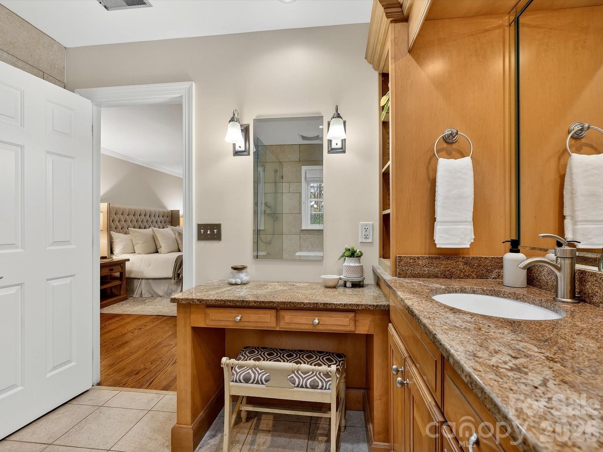 6344 Dovefield Road Charlotte, NC 28277 - Photo 28 of 46 a bathroom with a granite countertop sink and a mirror