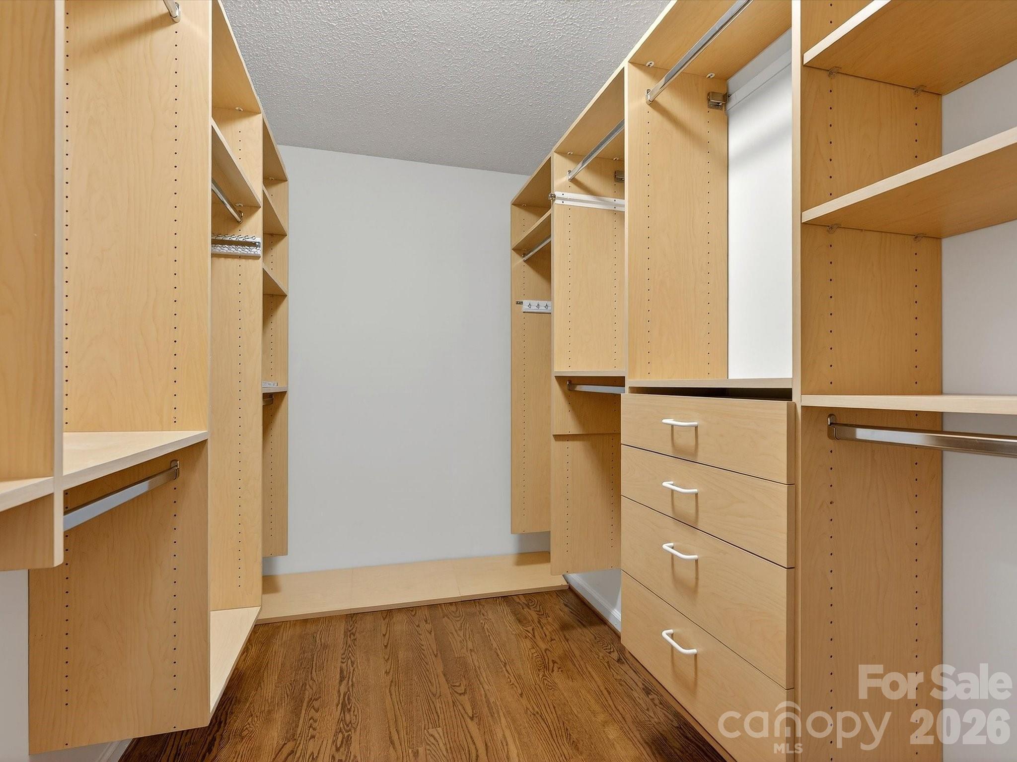 6344 Dovefield Road Charlotte, NC 28277 - Photo 29 of 46 a view of walk in closet with clothes and window