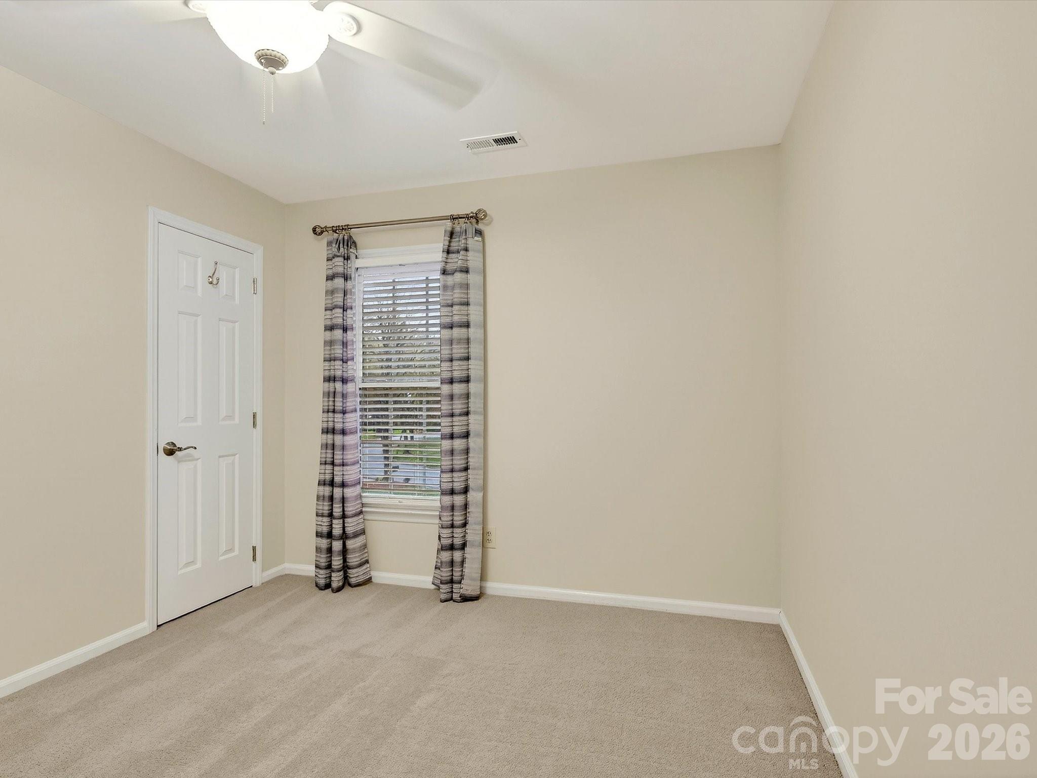 6344 Dovefield Road Charlotte, NC 28277 - Photo 32 of 46 an empty room with walk in closet and window