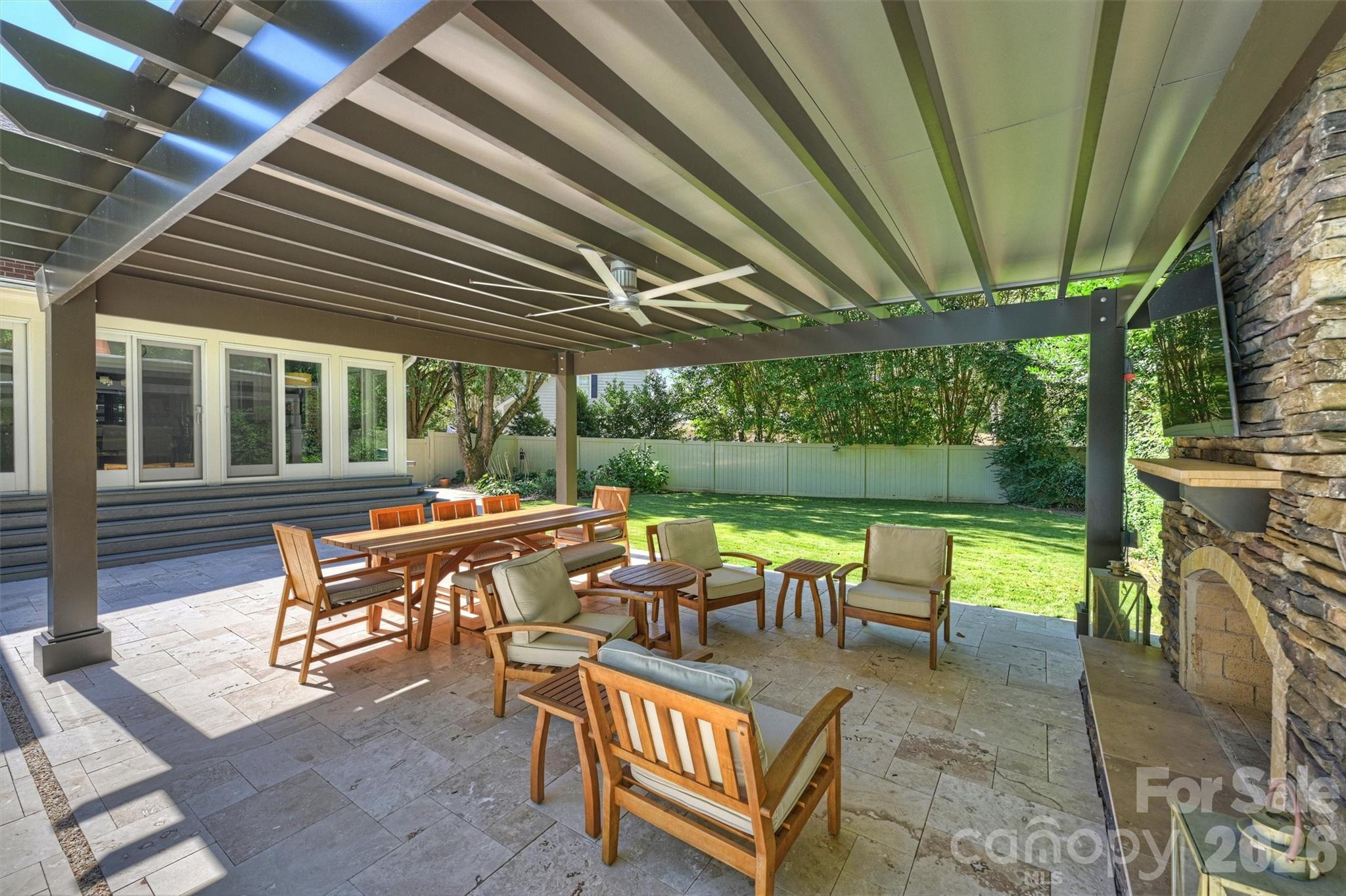 6344 Dovefield Road Charlotte, NC 28277 - Photo 34 of 46 a view of a patio with table and chairs potted plants with large tree