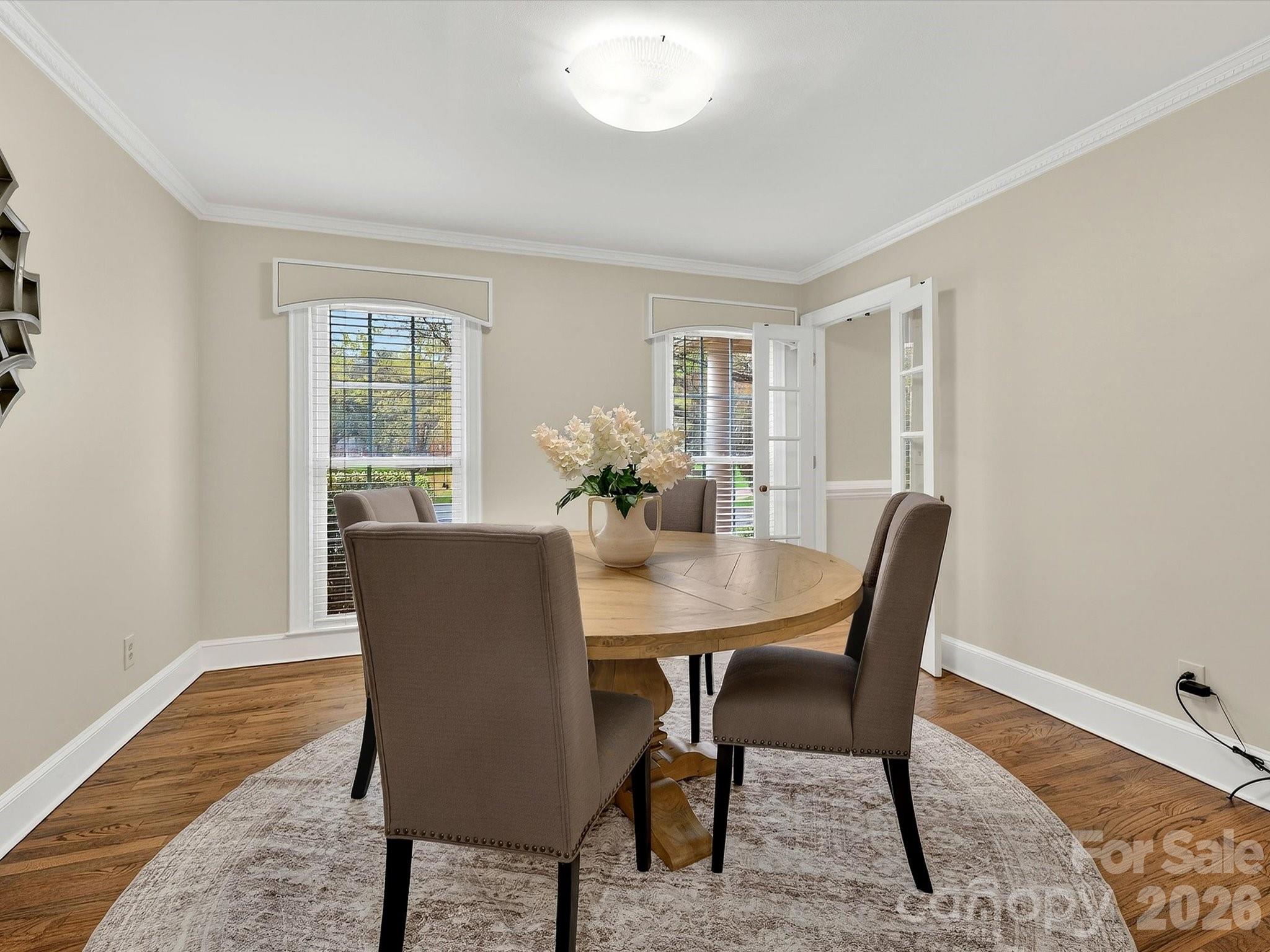 6344 Dovefield Road Charlotte, NC 28277 - Photo 7 of 46 a view of a dining room with furniture and wooden floor