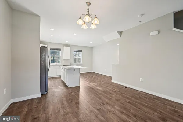 a view of a kitchen with a sink and a window