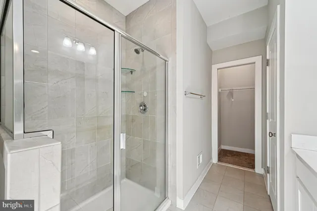 a bathroom with double vanity sinks and a large mirror