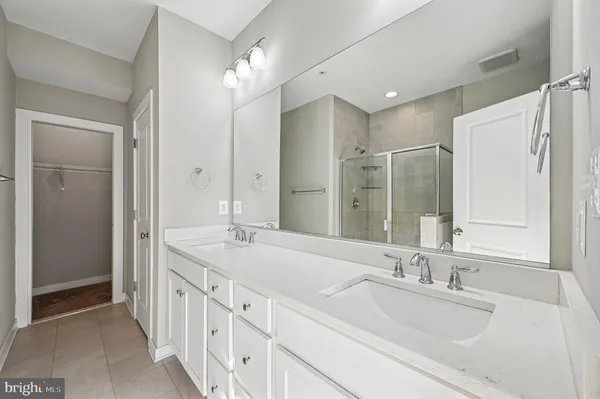 a bedroom with bed and window