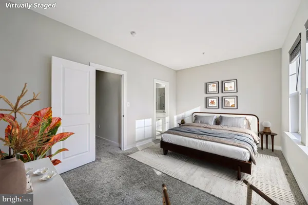 a bathroom with a shower sink vanity and mirror