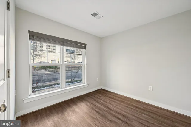 a view of a livingroom with furniture and a ceiling fan