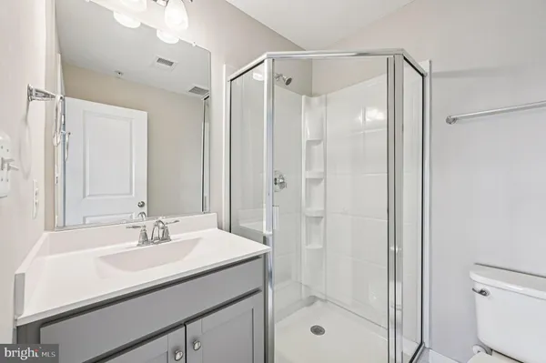 a view of wooden floor and windows in a room