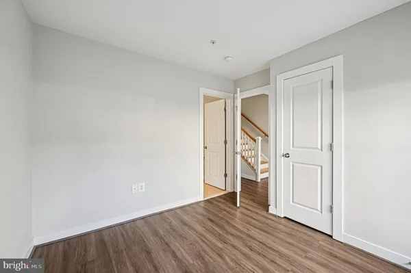 a view of wooden floor and brick walls