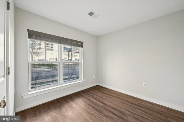 a view of a street with tall buildings