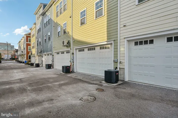 a front view of a building with glass top table and chairs