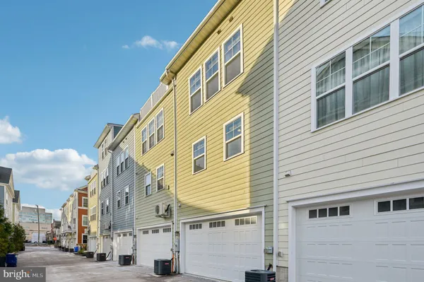 a picture of a bench in front of a gate