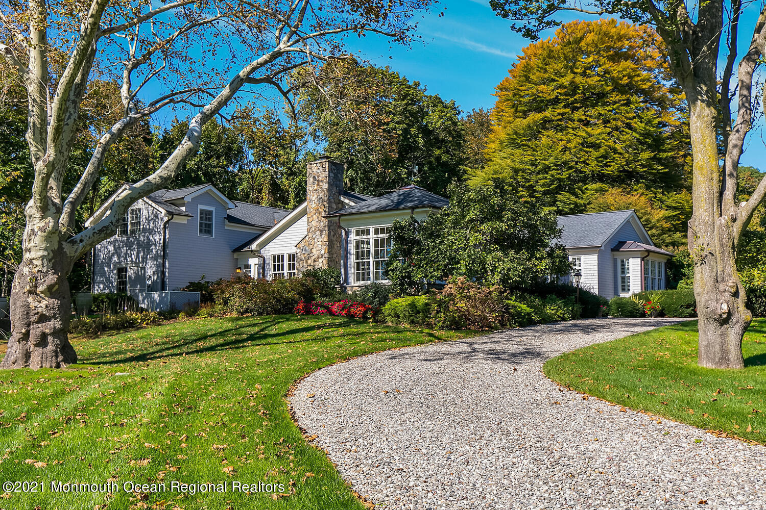 299 Cooper Road Middletown, NJ 07701 - Photo 1 of 27 a front view of a house with a yard and garage