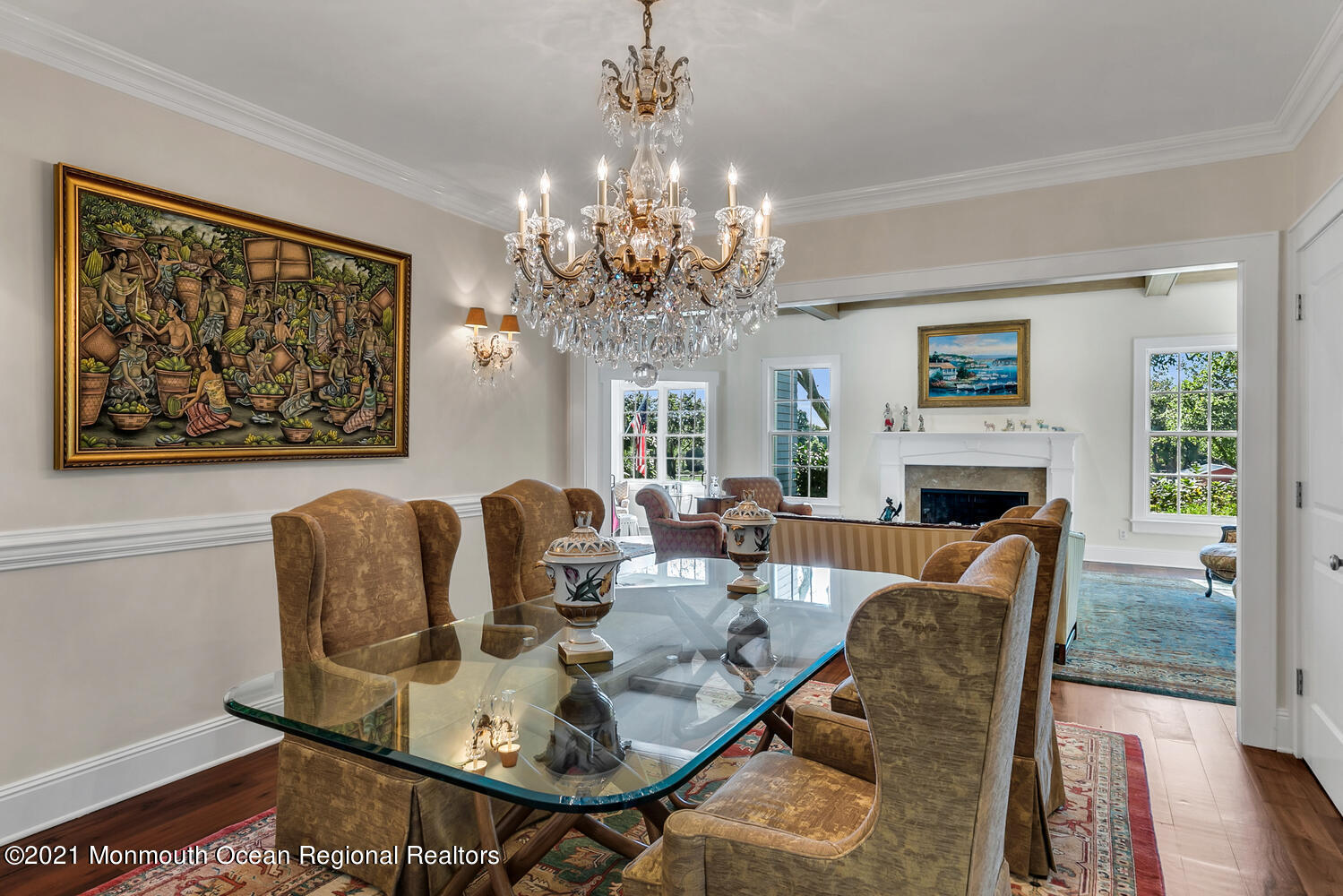 299 Cooper Road Middletown, NJ 07701 - Photo 11 of 27 a living room with furniture a chandelier and a fireplace