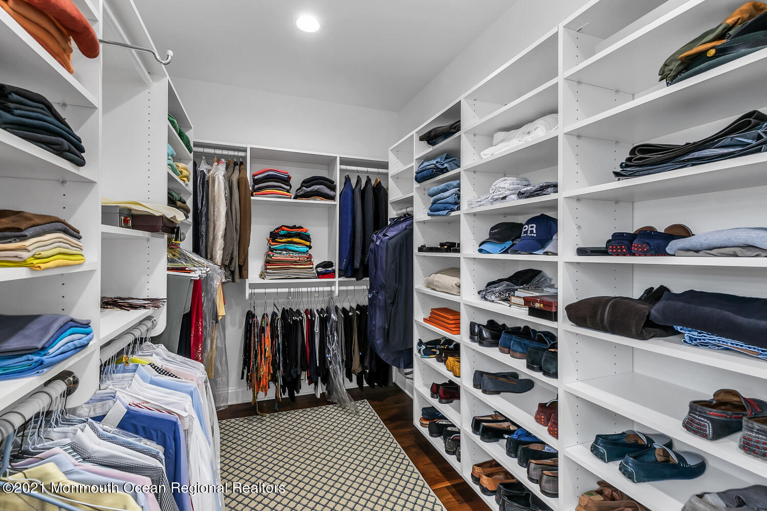 299 Cooper Road Middletown, NJ 07701 - Photo 17 of 27 a view of walk in closet with clothes and shoes