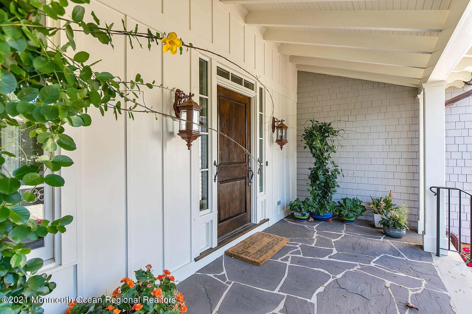 299 Cooper Road Middletown, NJ 07701 - Photo 3 of 27 a view of path along with potted plants