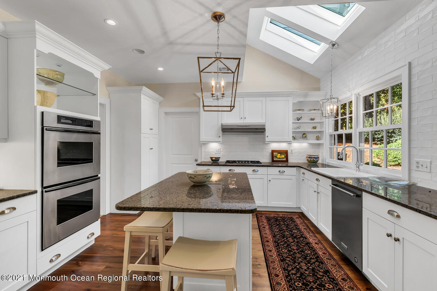 299 Cooper Road Middletown, NJ 07701 - Photo 7 of 27 a kitchen with stainless steel appliances granite countertop a sink stove and refrigerator
