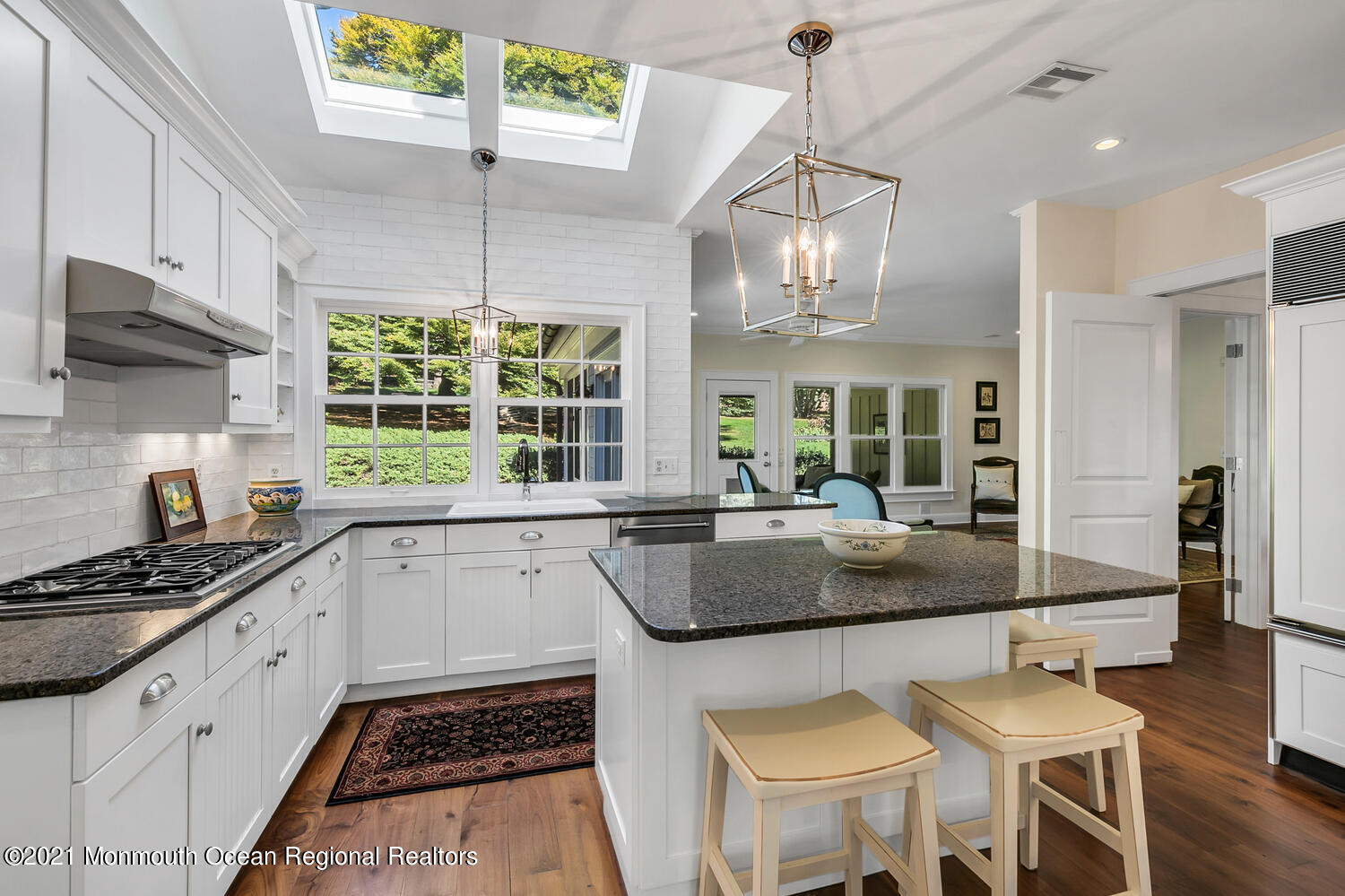 299 Cooper Road Middletown, NJ 07701 - Photo 8 of 27 a kitchen with stainless steel appliances granite countertop a stove a sink dishwasher and a refrigerator with wooden floor