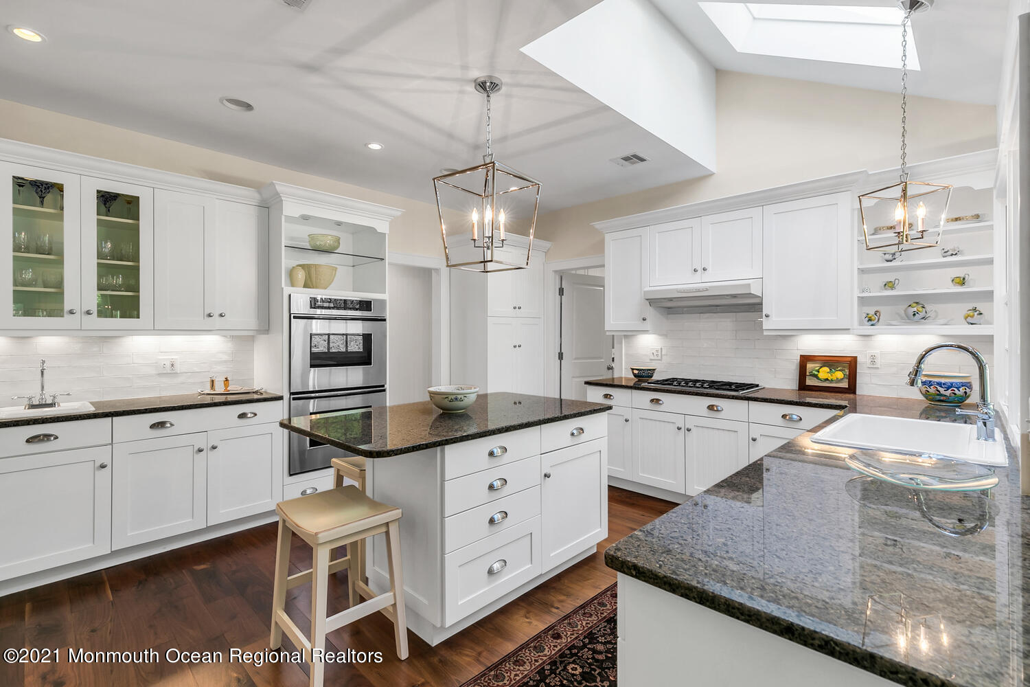 299 Cooper Road Middletown, NJ 07701 - Photo 9 of 27 a kitchen with granite countertop a sink a counter space appliances and cabinets