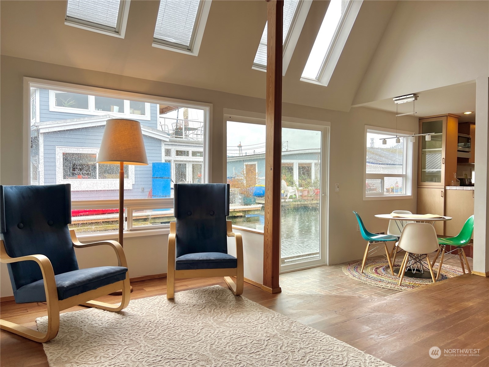 2219 Fairview Avenue East, Unit 11 Seattle, WA 98102 - Photo 5 of 15 a living room with furniture and a lamp