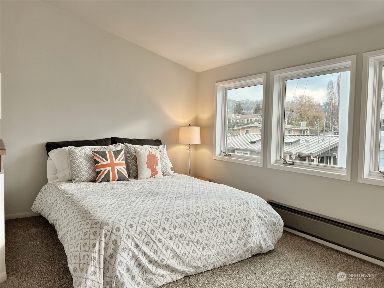 2219 Fairview Avenue East, Unit 11 Seattle, WA 98102 - Photo 9 of 15 a bedroom with a large bed and a large window