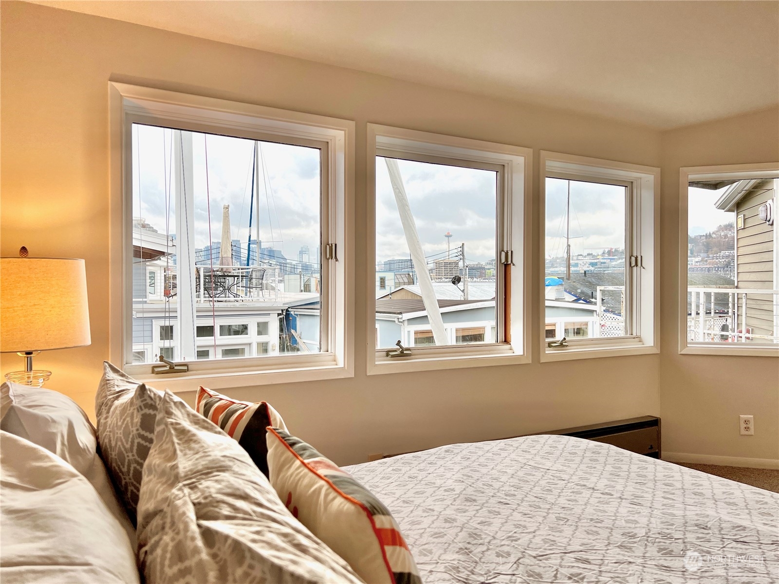 2219 Fairview Avenue East, Unit 11 Seattle, WA 98102 - Photo 10 of 15 a bedroom with a bed and a large window with outer view