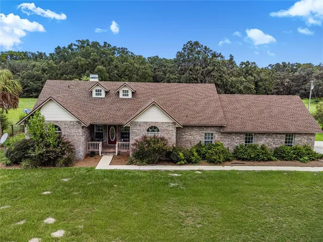 a view of a garden with an outdoor space and seating area