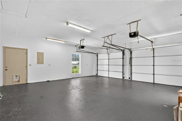 a view of storage and utility room with wooden floor