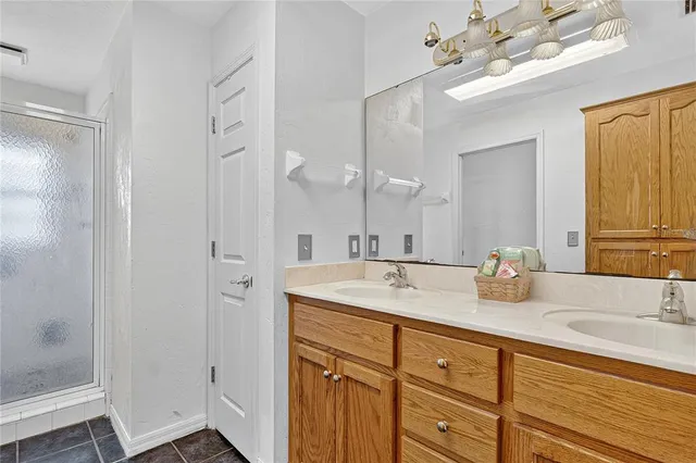 a kitchen with stainless steel appliances granite countertop a refrigerator a stove a sink and dishwasher