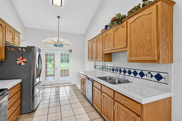 a view of a kitchen with furniture and wooden floor